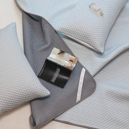Gray textured decorbites ice bean cooling sleep mat with subtle white stripe from light blue gray bed sheet set