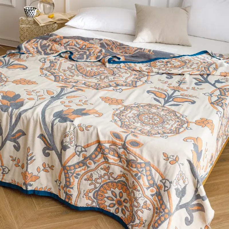 Light blue and gray patterned cotton gauze summer blanket with cream floral mandala and teal border decorbites cotton gauze