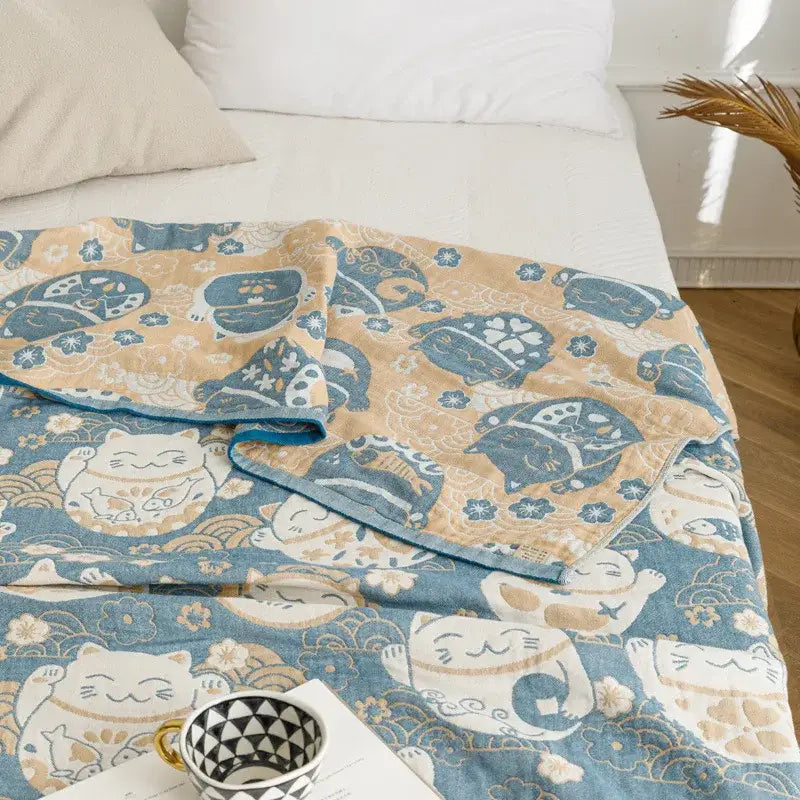 Light blue and gray decorbites cotton gauze summer blanket with beige and blue lucky cat pattern and soft texture