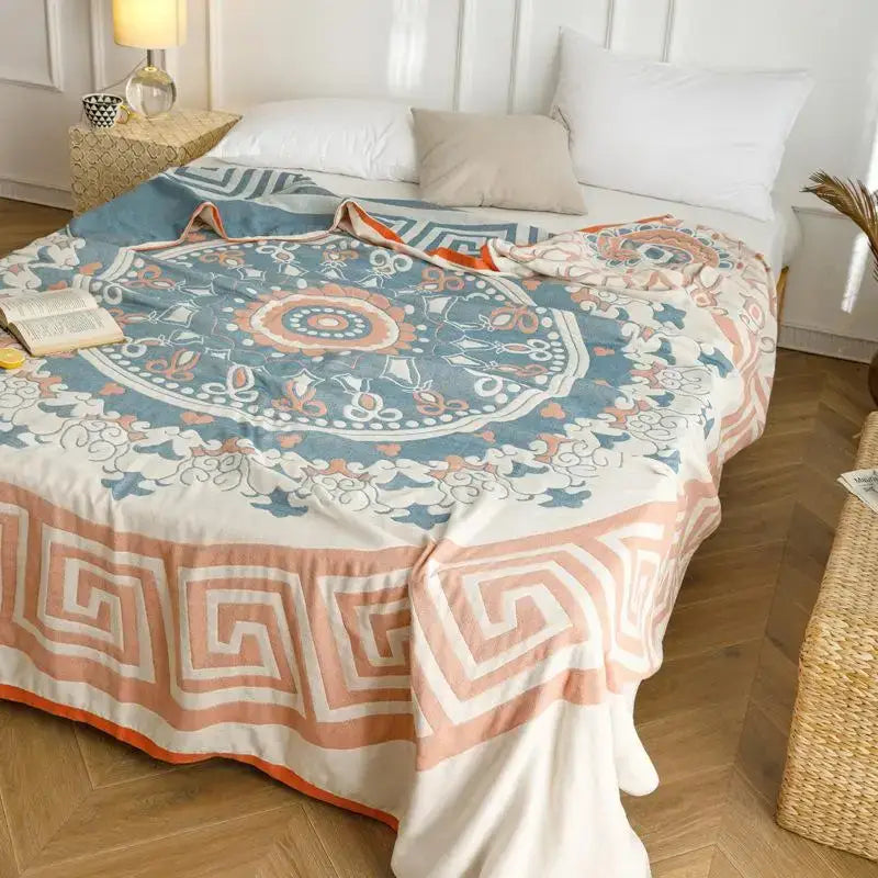 Soft pastel cotton gauze summer blanket with detailed mandala pattern in blue and peach for elegant decorbites cotton gauze decor