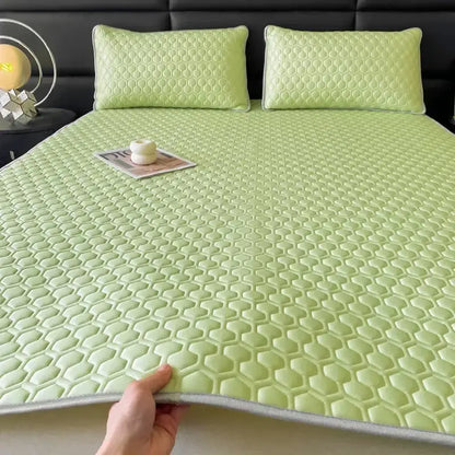 Light green hexagonal-patterned cooling latex filled bed mat with gray border for bedroom use
