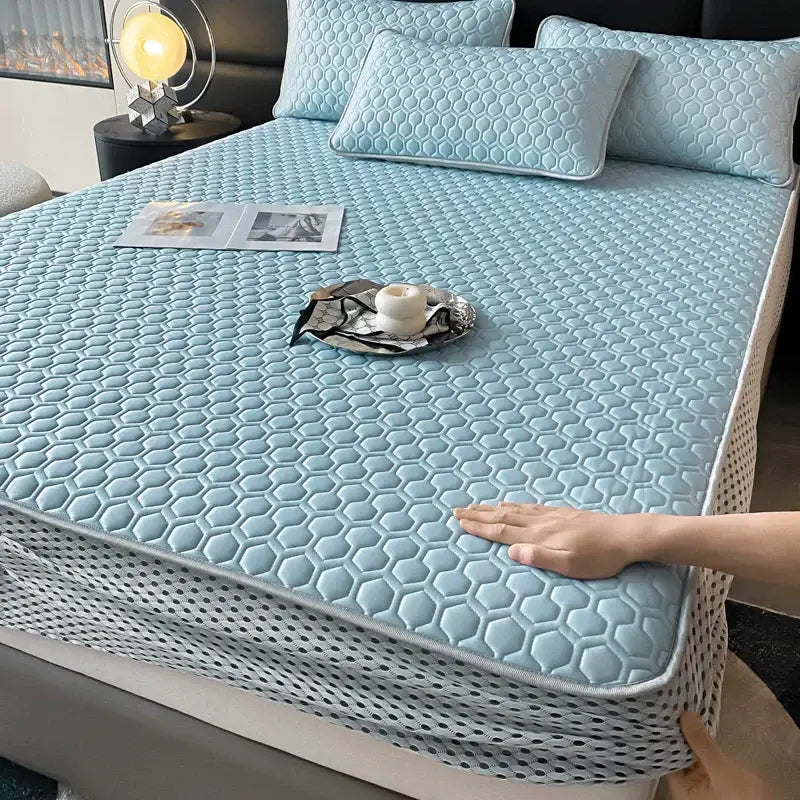 Light blue hexagonal ice silk cooling bed mat set with breathable mesh border for comfortable sleep