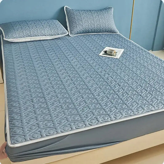 Light blue quilted latex fitted sheet set with subtle geometric pattern and white piping for bedroom bed pad