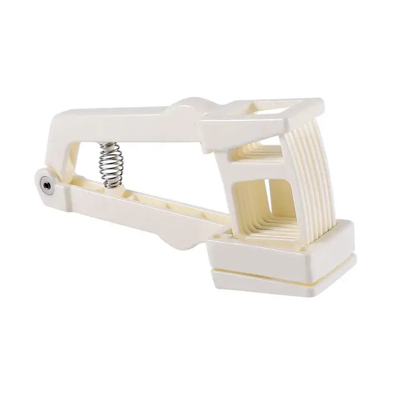 Cream-colored plastic garlic press slicer with metal spring and adjustable jaw mechanism for easy pressing