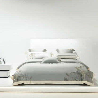 Light gray eucalyptus lyocell soft bedding set with delicate leaf embroidery and cream-colored piping by decorbites eucalyptus lyocell