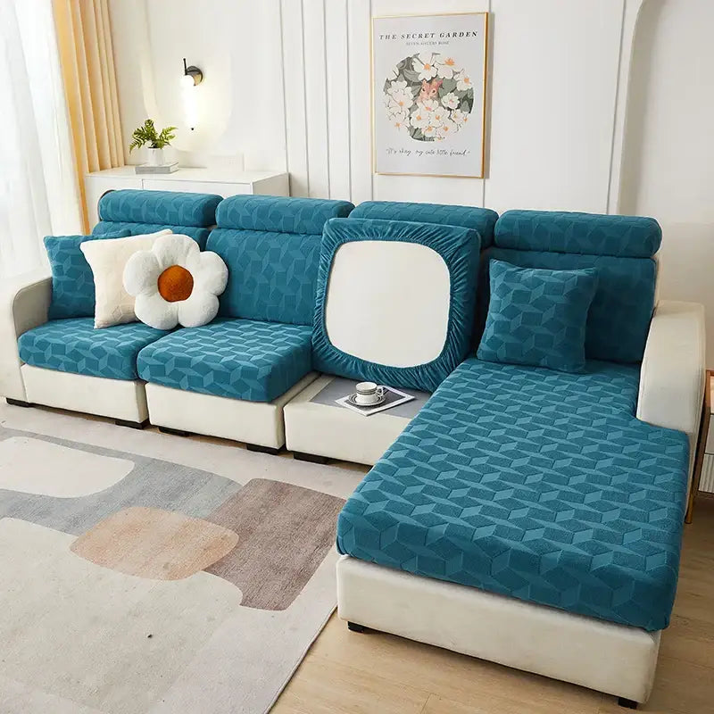 Teal geometric-patterned decorbites jacquard sofa stretch cover with white pillow and matching cushion for living room use