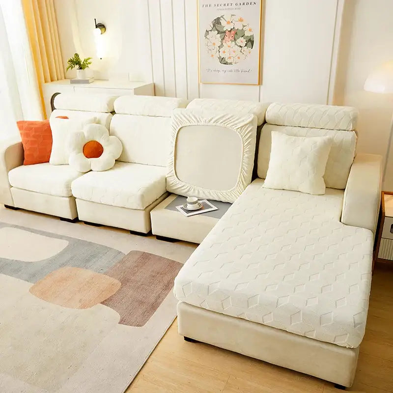 Cream-colored quilted decorbites jacquard sofa seat cover with diamond pattern snugly fitted on sectional couch