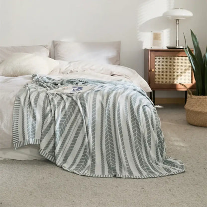 Light green leaf pattern bamboo knitted cooling blanket featuring a gray and white striped throw design for bedroom decorbites
