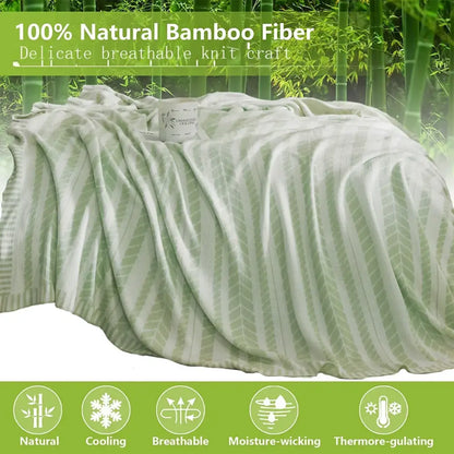 A soft light green decorbites bamboo knitted cooling blanket with a subtle leaf pattern for bedroom use