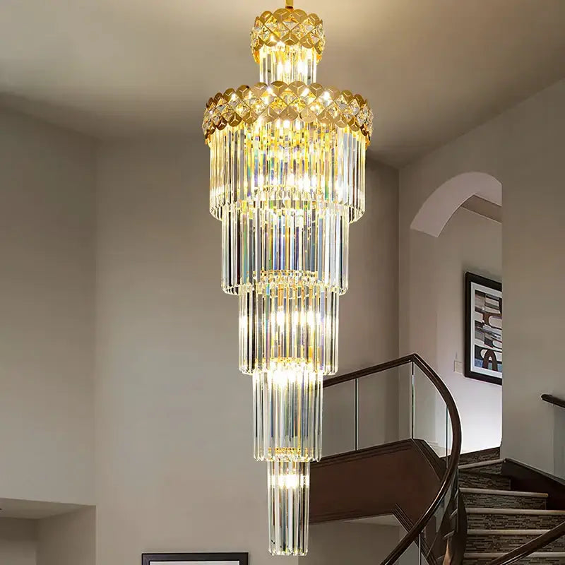 A multi-tiered gold light luxury crystal chandelier with cascading clear glass rods for living room decorbites light luxury