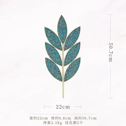 A teal glittery leaf-shaped brooch with gold-tone iron stem, ideal for decorbites light luxury wall decoration