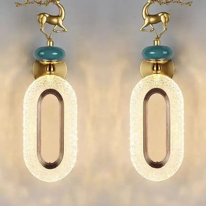 Gold deer-shaped wall lamp set with teal glass orbs and frosted oval diffusers for light luxury modern decorbites decor