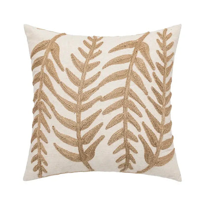 Cream-colored cushion cover with intricate textured gold leaf embroidery in decorbites linen embroidery leaves design