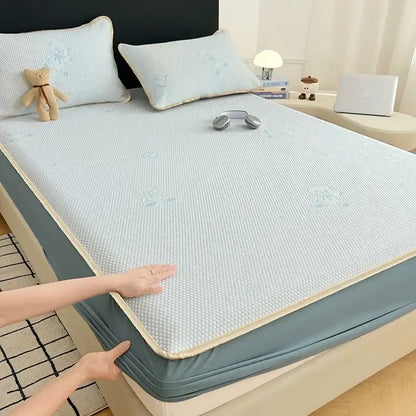 Light blue textured cooling mat with bear jacquard pattern and beige border for bedroom mattress pad use