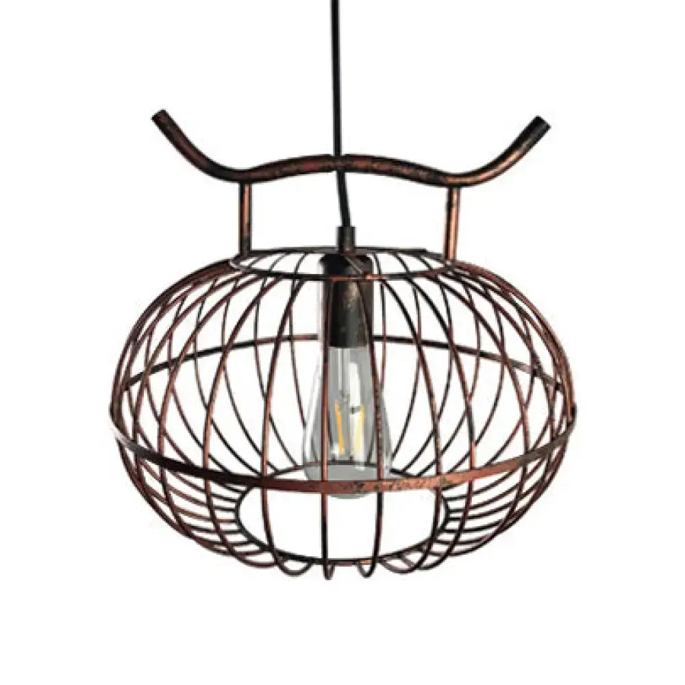 Copper-toned DecorBites™ lodge style metal pendant light with rust aged brass finish and lantern design featuring Edison bulb