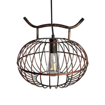 Copper-toned DecorBites™ lodge style metal pendant light with rust aged brass finish and lantern design featuring Edison bulb