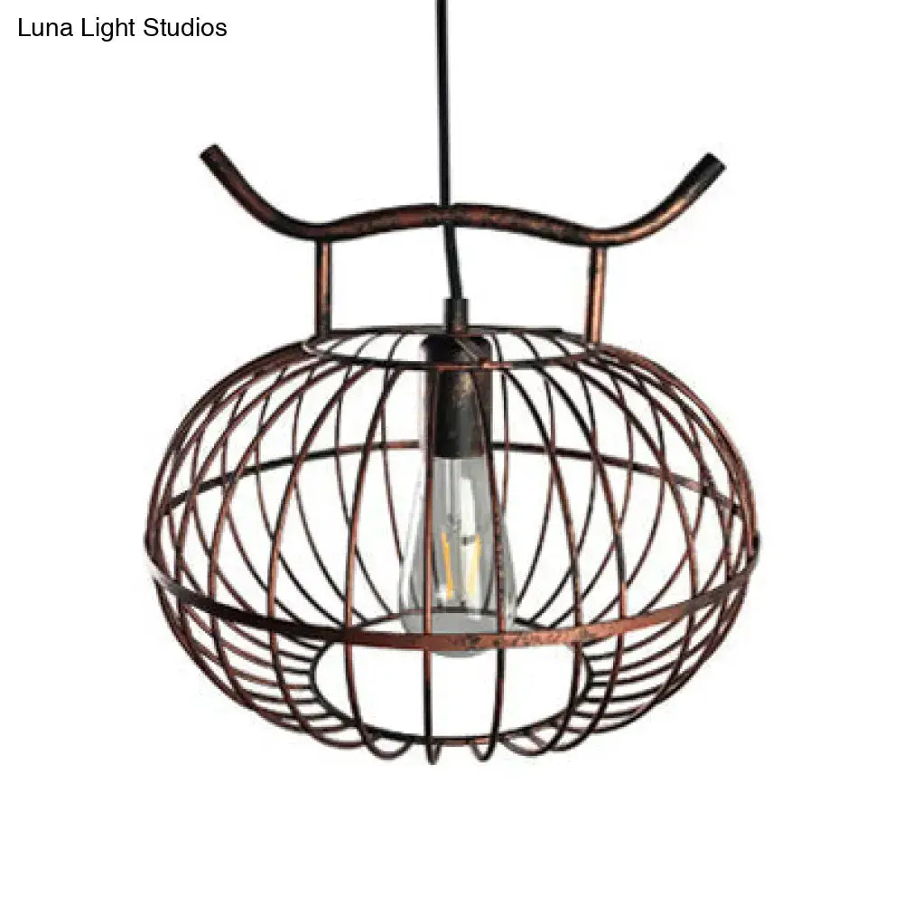 Decorbites™ lodge style metal pendant light with copper-toned wire cage and exposed edison bulb in rust aged brass lantern design