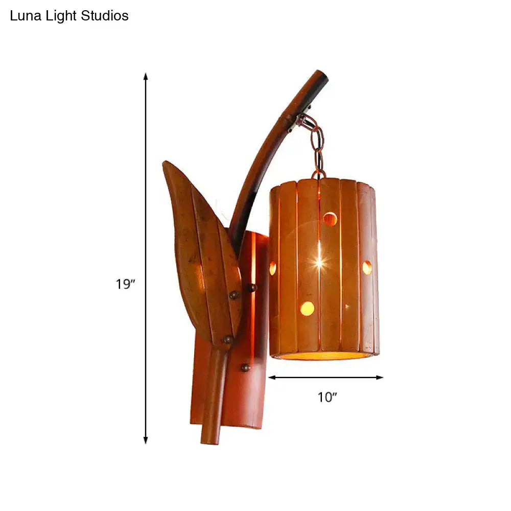 Copper-toned metal wall lamp with leaf-shaped bracket and cylindrical shade featuring vertical slats for 220v-240v use
