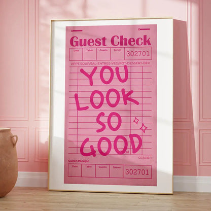 A framed pink wall art canvas by decorbites featuring a bold magenta kind love quote with a restaurant receipt grid design