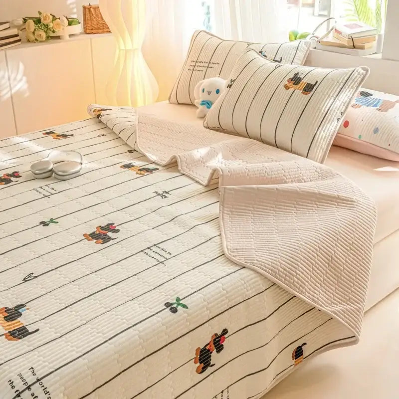 Cream-colored quilted cotton mattress mat with decorbites cartoon pattern featuring dachshund prints and black stripes