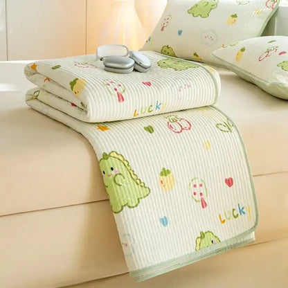 A cream-colored quilted cotton mattress mat featuring a lucky dinosaur decorbites cartoon pattern for bedroom bedding