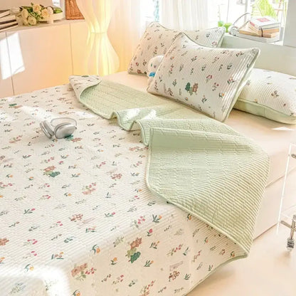 Light green quilted mattress mat with delicate floral decorbites cartoon pattern cotton design and matching pillowcases