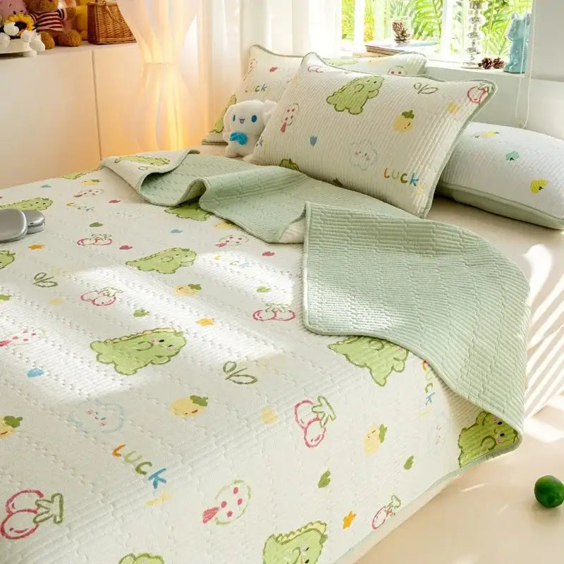 Light green and white quilted mattress mat featuring a decorbites cartoon pattern cotton with dinosaurs cherries and luck letters