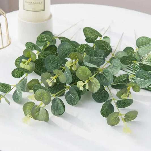 Lush artificial eucalyptus leaves garland with glossy green leaves and white flowers decorbites eucalyptus leaves decor