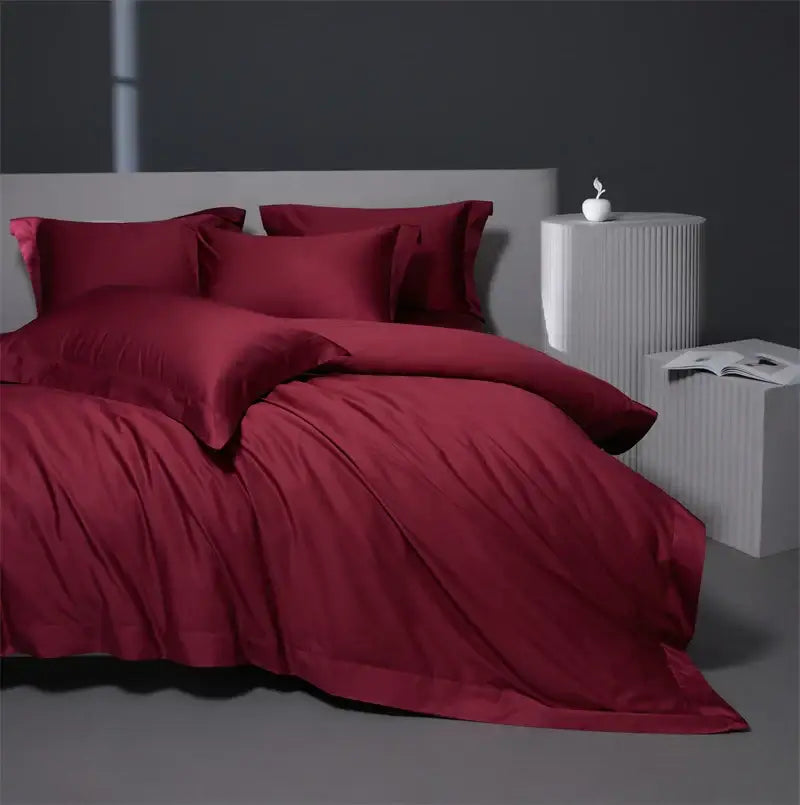 Deep red satin egyptian cotton bedding set with matching pillows and duvet in burgundy red for bedroom use
