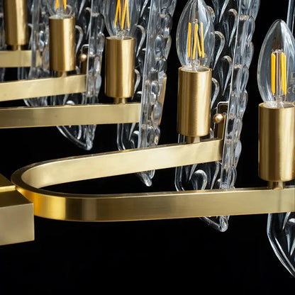Luxe gold glass led ceiling chandelier with clear leaf-shaped glass shades and exposed filament bulbs for living room