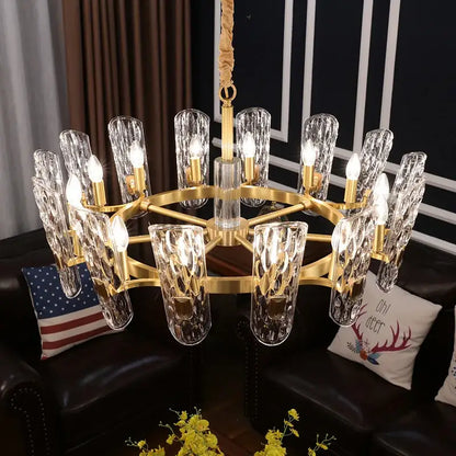 Luxe gold glass led ceiling chandelier with textured clear glass shades and multiple illuminated bulbs for living room
