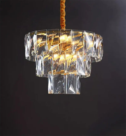 Luxe gold steel crystal pendant light with multi-tiered faceted glass panels and gold steel crystal structure for dining room decorbites