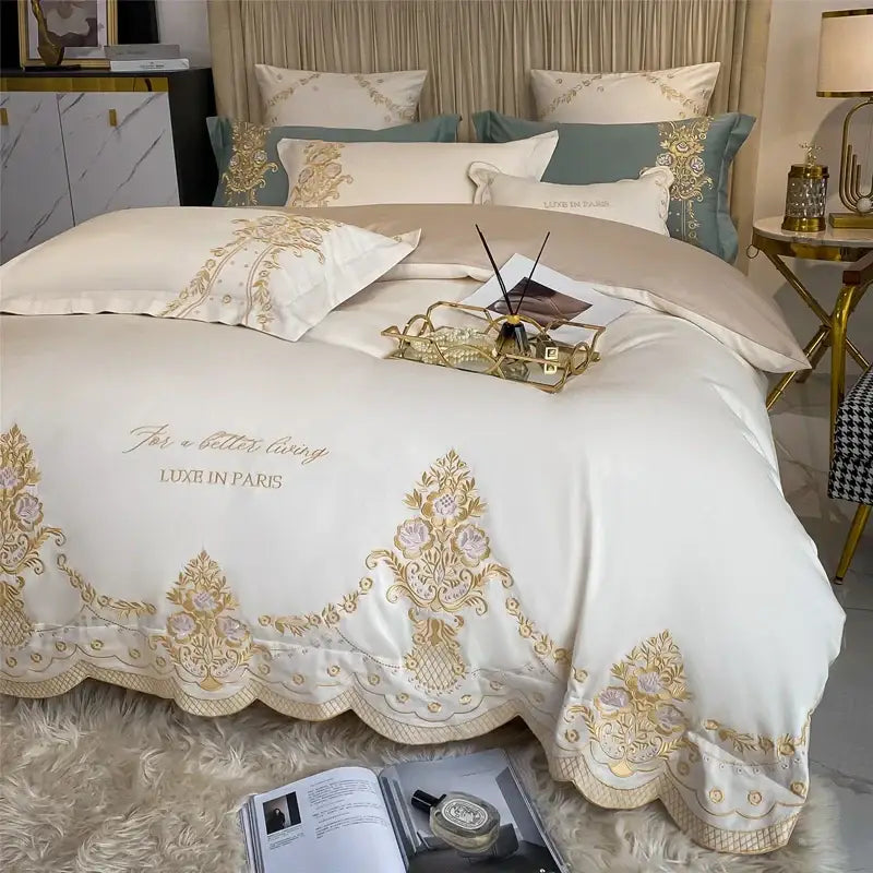 Cream-colored satin bedding set with gold embroidery and scalloped hem decorbites 1000tc egyptian luxe ivory set