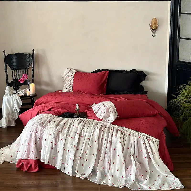 Luxe red and white floral ruffled bedding set with delicate embroidery made of egyptian cotton lace ruffles