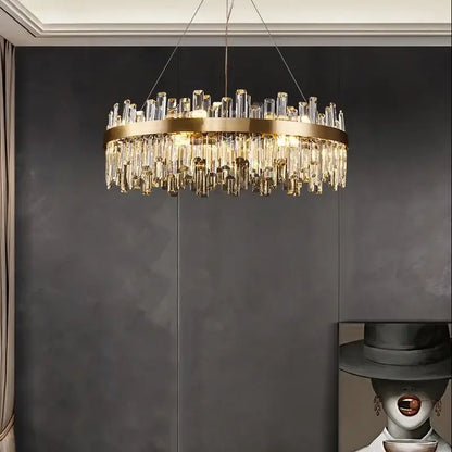 A luxurious gold crystal led chandelier with circular metal frame and clear prisms for living and dining room