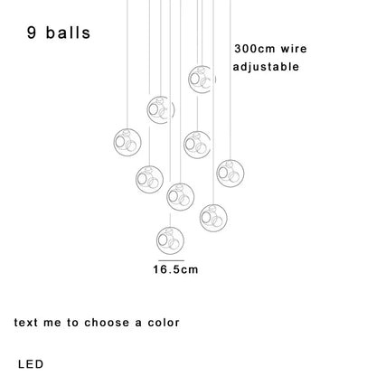 Nine amber glass sphere pendant lights with clear glass and internal rings on adjustable 300cm wires for dining room decorbites clear glass pendant