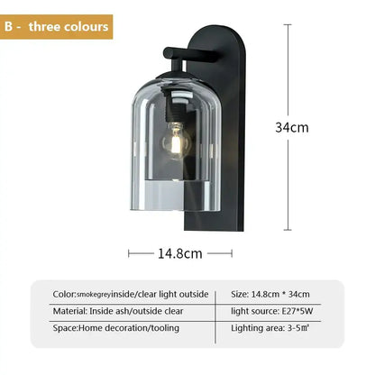 Luxury amber glass wall art light featuring a black wall art light sconce with clear bell-shaped glass shade and exposed bulb