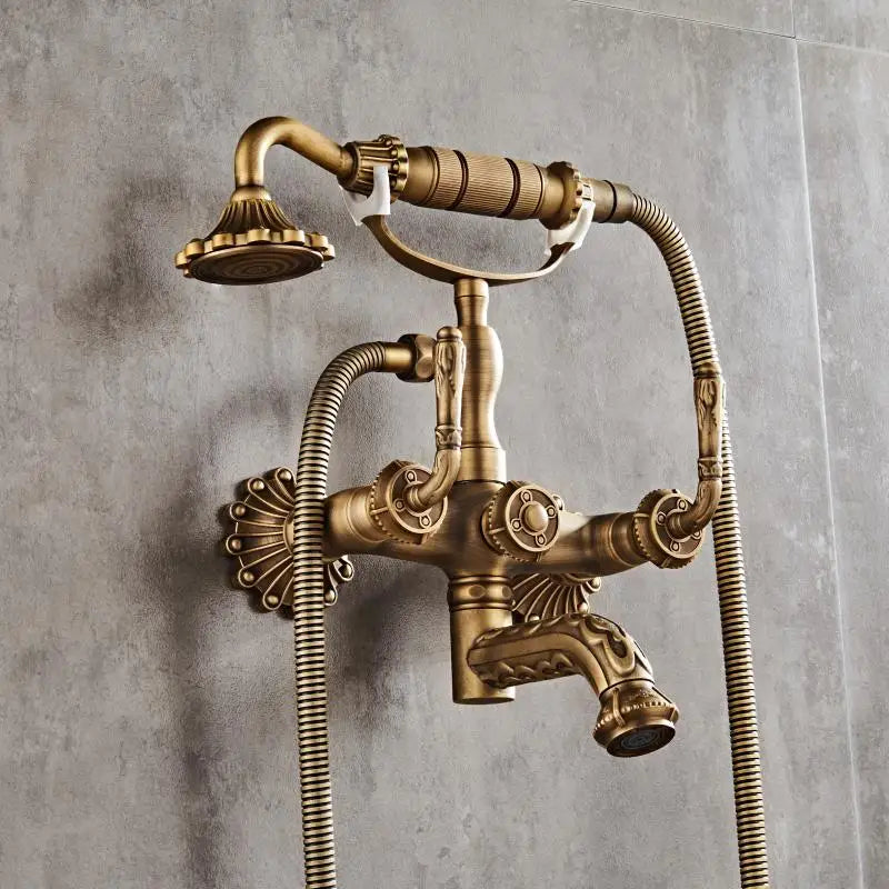 Luxury antique brass wall mounted shower faucet with vintage design, ornate detailing, and flexible handheld shower head kit
