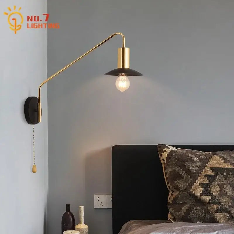 Luxury black and gold swing arm wall lamp with brass finish black shade and exposed bulb by decorbites for bedroom reading
