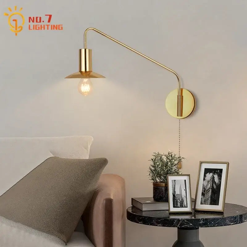 Luxury black gold swing arm wall lamp with brass finish, curved arm, and exposed bulb for bedroom reading decorbites black gold