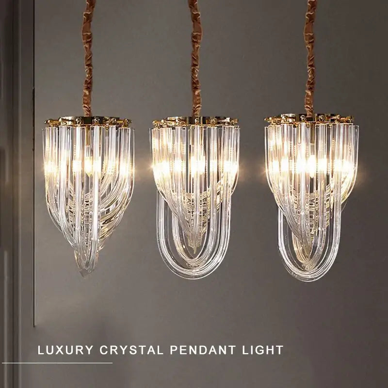 Luxury black stainless steel glass ribbon chandelier with three clear crystal pendant lights and gold accents for living room decorbites black stainless