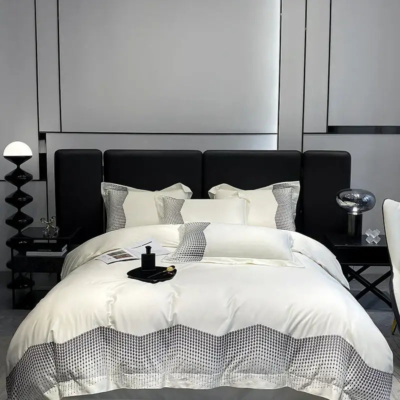 Luxury blue and champagne bedding set featuring white satin duvet cover with black wave pattern and decorbites 1000tc cotton embroidery