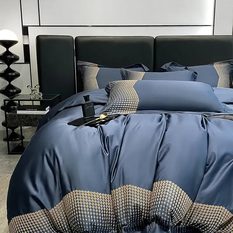 Deep blue satin duvet cover with gold-toned geometric embroidery on decorbites 1000tc cotton embroidery bedding set