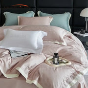 Luxury blush pink floral jacquard satin duvet cover set with delicate embroidery and cream piping for elegant bedroom bedding