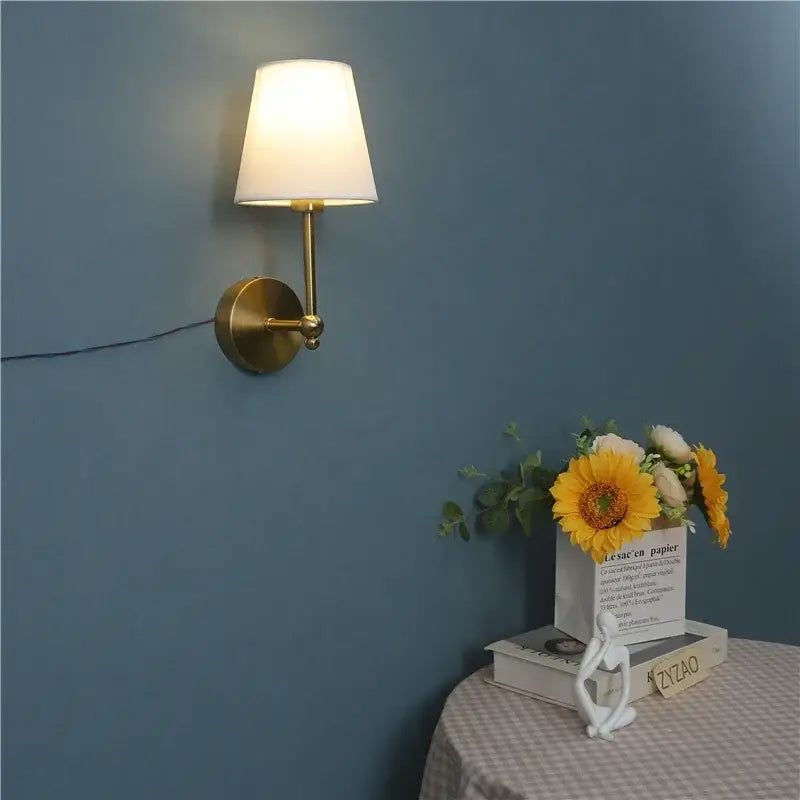 Luxury gold wall lamp with brass finish and white fabric shade for elegant bedroom decorbites led black lighting