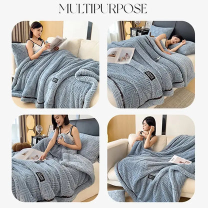 Soft light blue plush throw blanket with black trim featuring luxury coral fleece texture for winter bedroom use