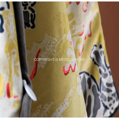 Yellow curtain with abstract stylized animal figures in black gray and red complements decorbites coral lynx velvet cushion cover