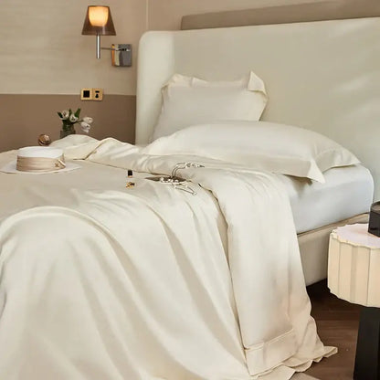Luxury cream bedding set with cream-colored satin duvet cover featuring silver deer embroidery in decorbites 1400tc pima cotton