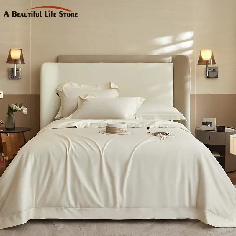 Cream-colored satin bedding set with smooth texture and elegant pleats in decorbites 1400tc pima cotton material