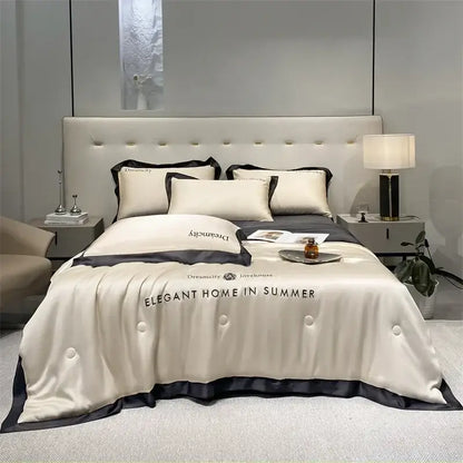 Luxury cream and black ice silk embroidered quilt set featuring a cream satin duvet cover with black trim and elegant text